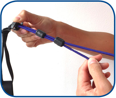 6. To shorten arm bungees, squeeze both sides of adjuster while pulling loose end of bungee towards you (loose part with black end cap)