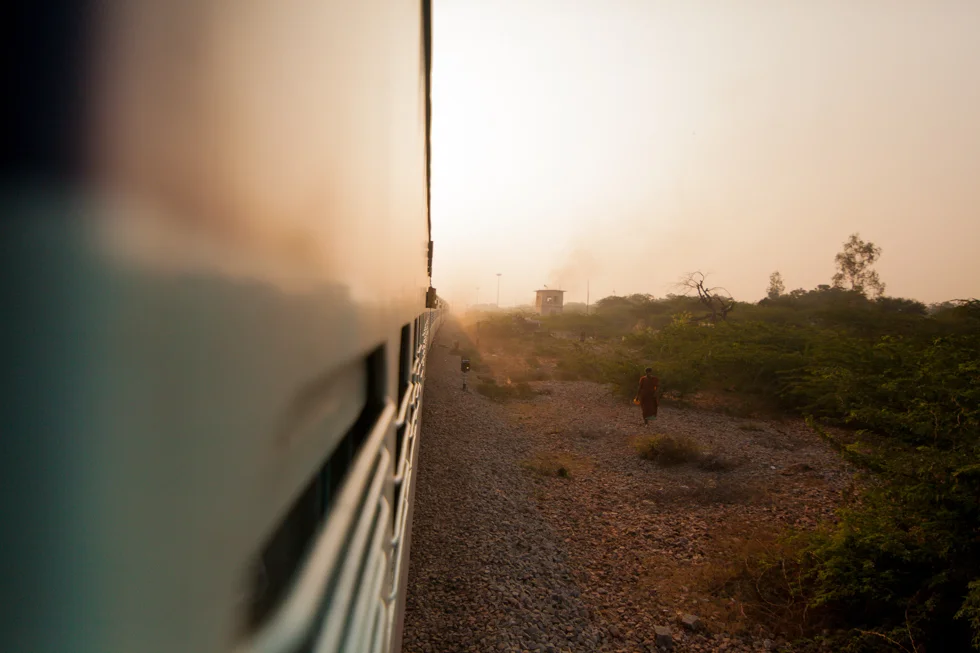 hanging out of train india