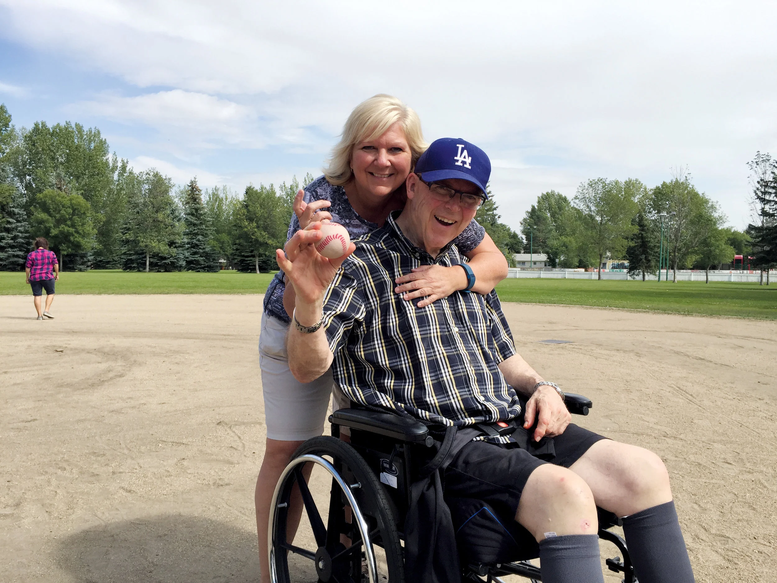 Colleen Pylypow, Sherbrooke’s Manager of Volunteers and Global Events, and resident Malcolm Gilbert enjoying a game of baseball. Photo courtesy of Sherbrooke Community Centre.