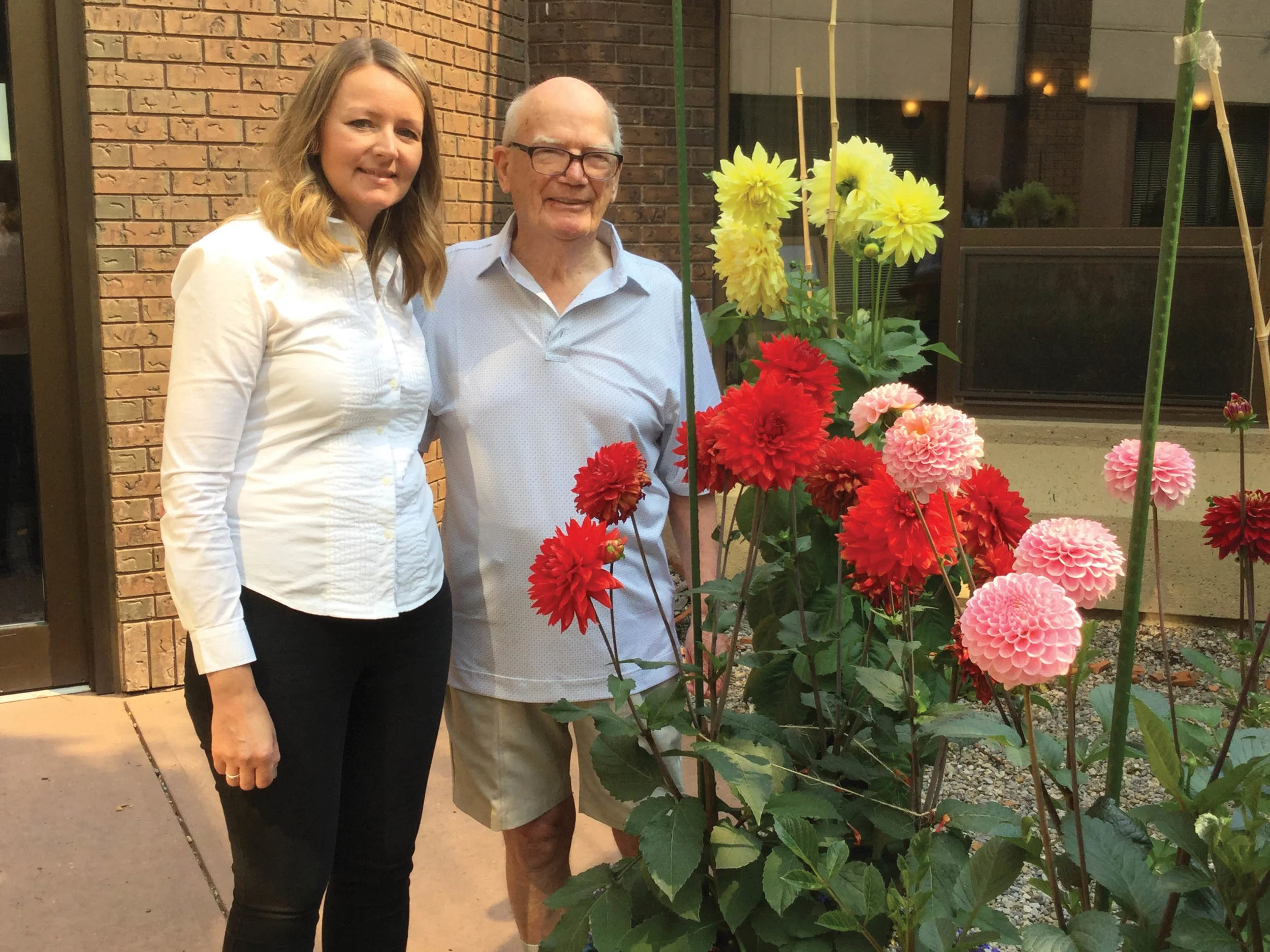 Ron Freckleton and Sarah Salus, director of philanthropy and engagement, the Alzheimer Society of Calgary, with dahlias. Photos courtesy Ron Freckleton