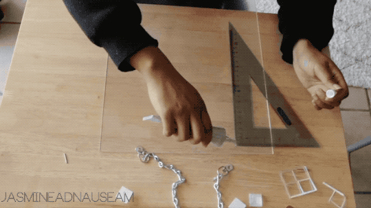 In the gifs above, I’m using a small piece of excess wire to help tamp down the metal hanger and stick it to the acrylic.