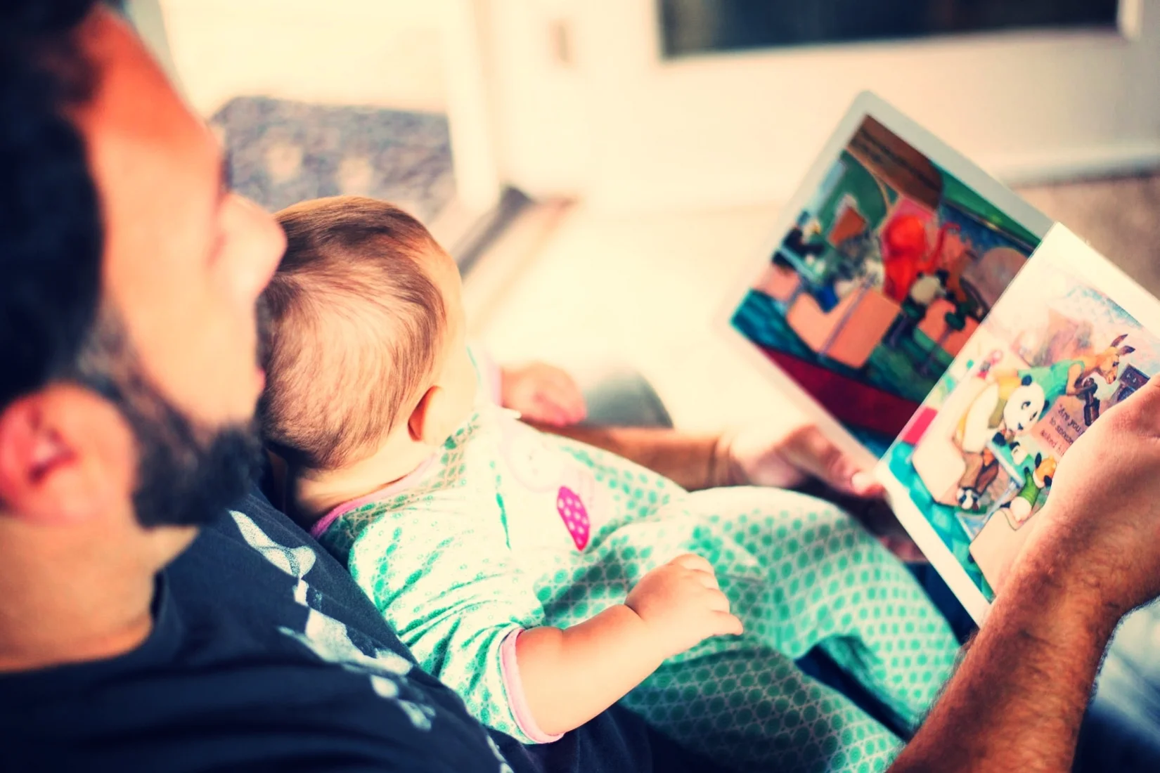 Dad Reading to Kid.jpeg