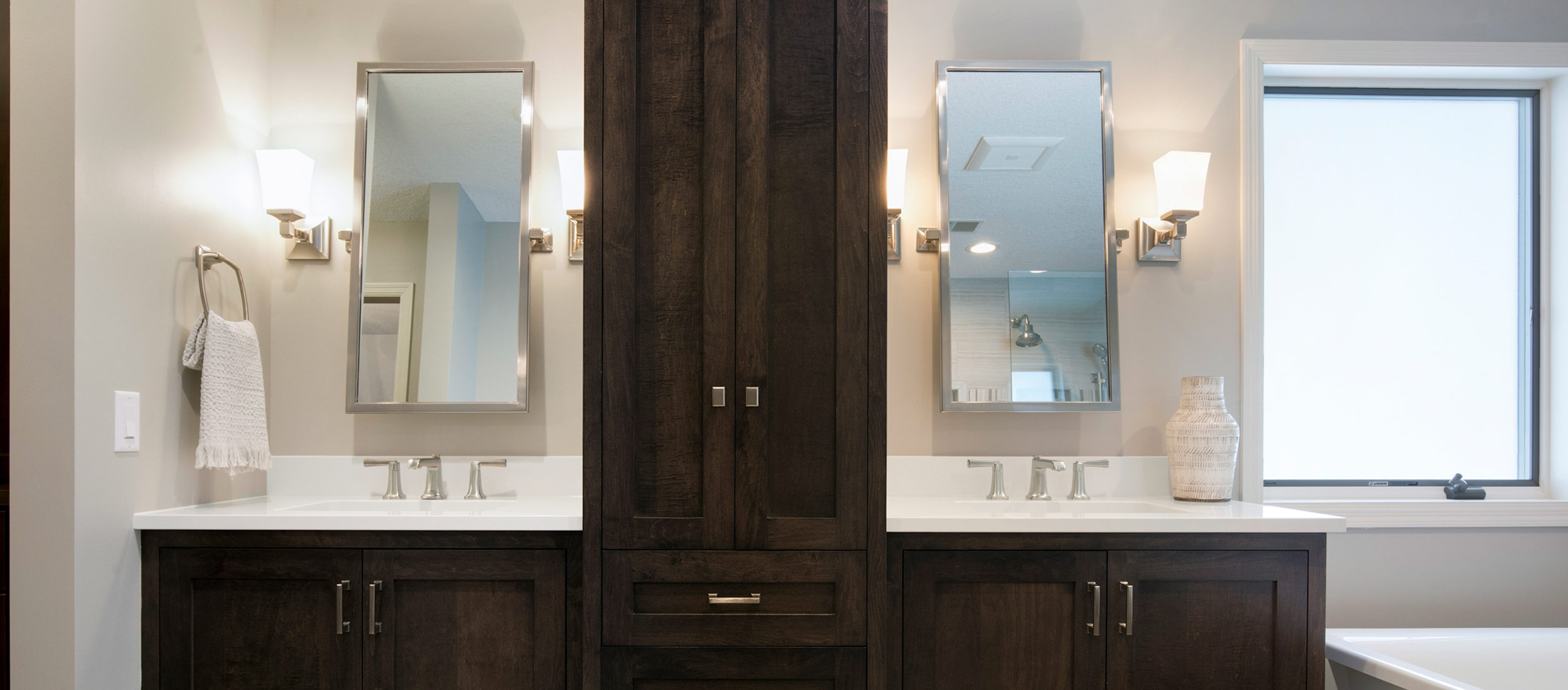 Master bathroom remodel with dark cabinets and stainless steel hardware