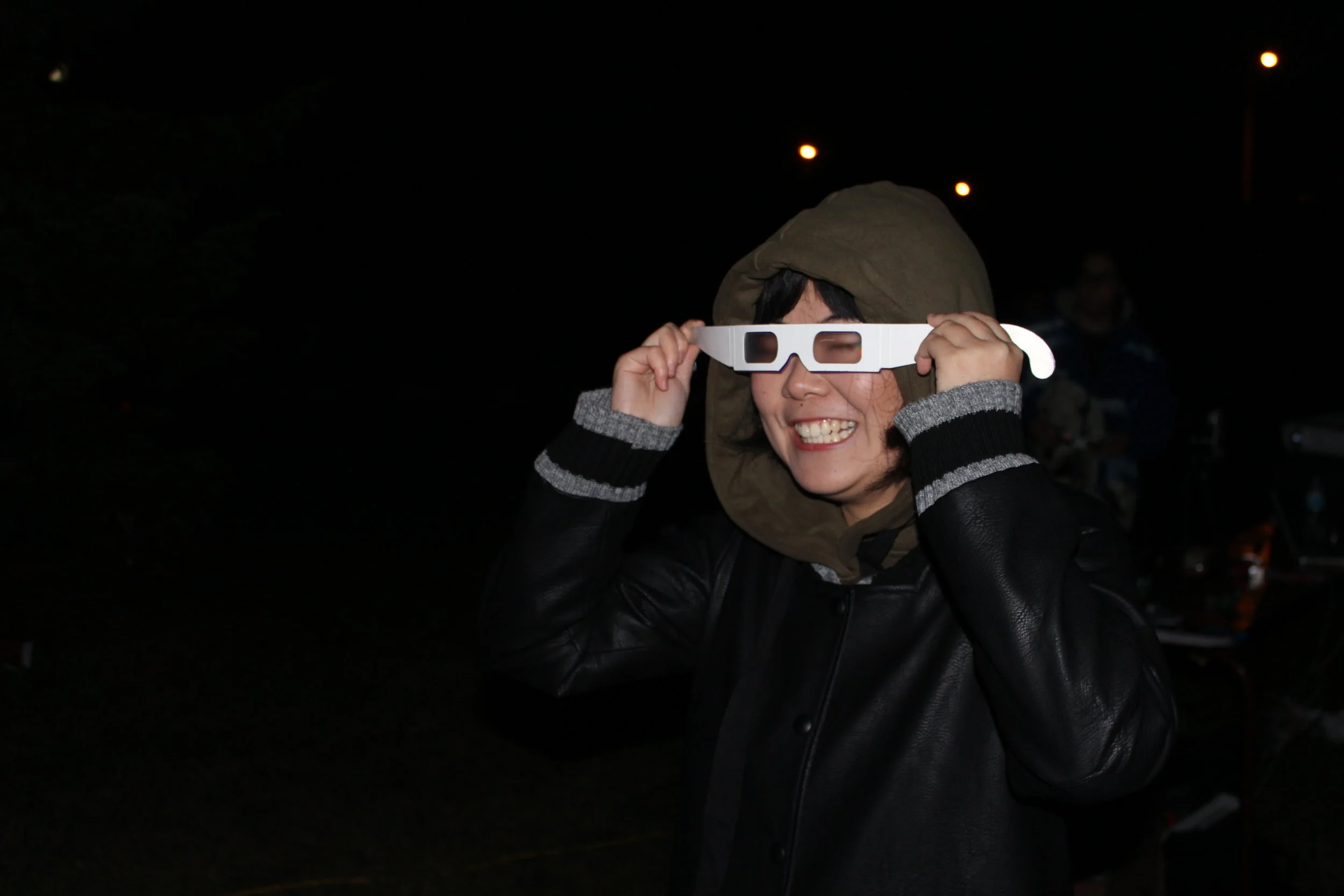 One of our students, Gen, having fun with the diffraction grating glasses.