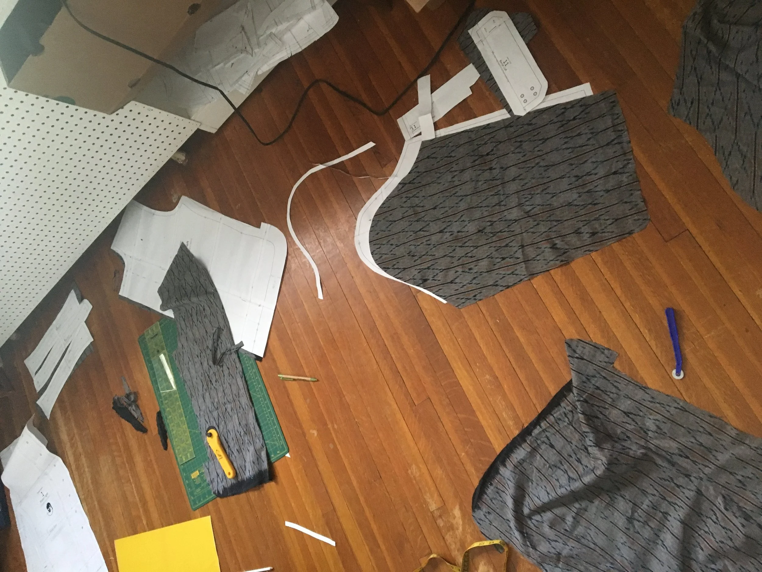 pattern pieces on the sewing room floor