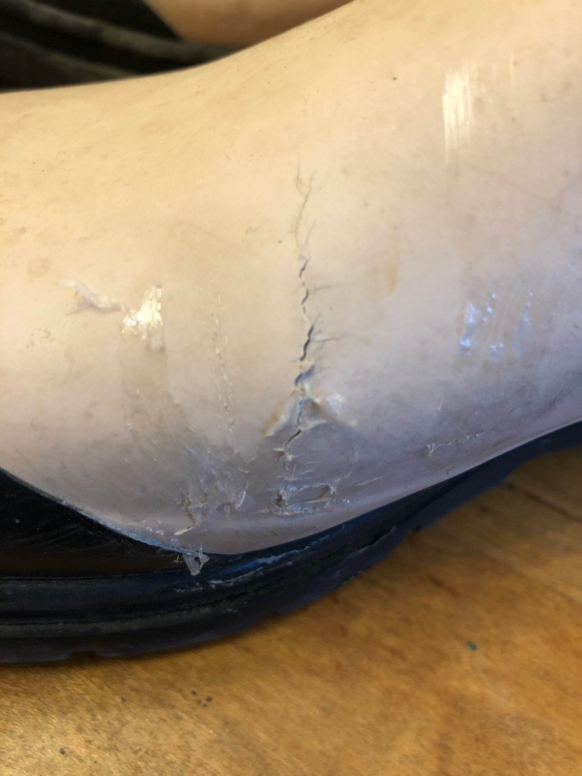 cracked rubber boots in need of a mend