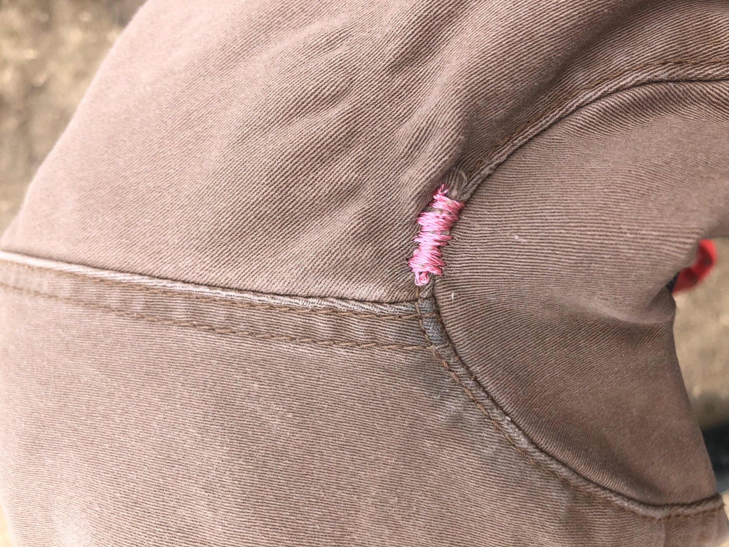 small hole at gusset covered with satin stitch