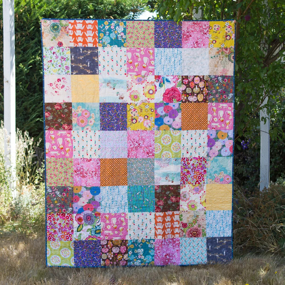 Little Girls’s Boho Squares Quilt Finished via www.helloquilting.com
