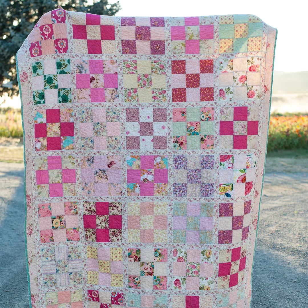 Pinksplosion Checkered Nine-Patch Quilt Finished via www.helloquilting.com