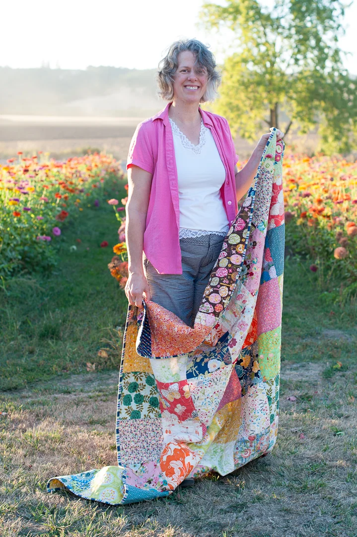 Angela with the Boho Squares Quilt via www.helloquilting.com