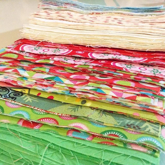 Fabric for the Scrappy Christmas Triangles Quilt via www.helloquilting.com