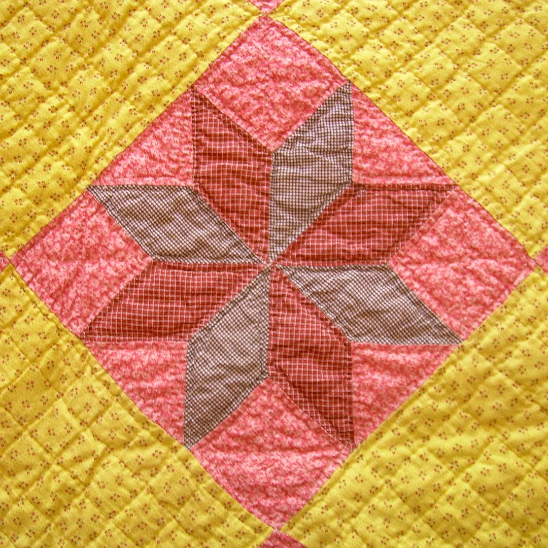 Single LeMoyne Star Block from Antique Chrome Yellow and Double Pink Quilt via www.helloquilting.com