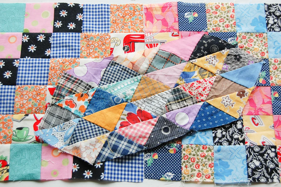 Unfinished Ocean Waves Block with Antique-Inspired Scrappy-Trip-Around-the-World Quilt via www.helloquilting.com