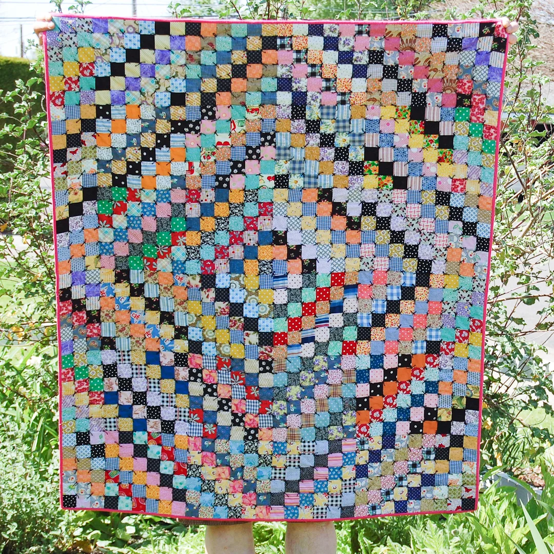 Antique-Inspired Scrappy Trip-Around-the-World Quilt via www.helloquilting.com
