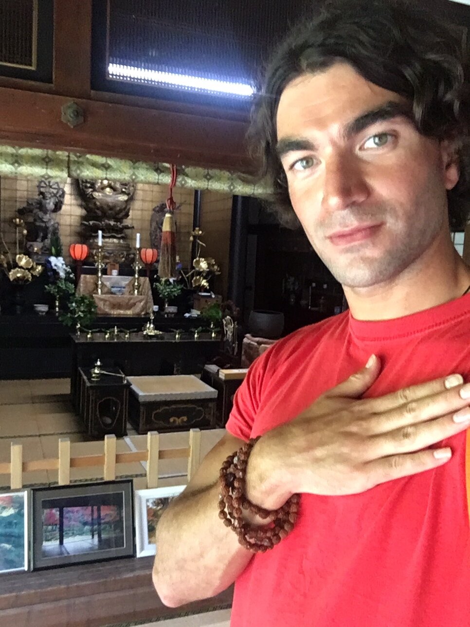 Next to a shrine with special Buddhist beads