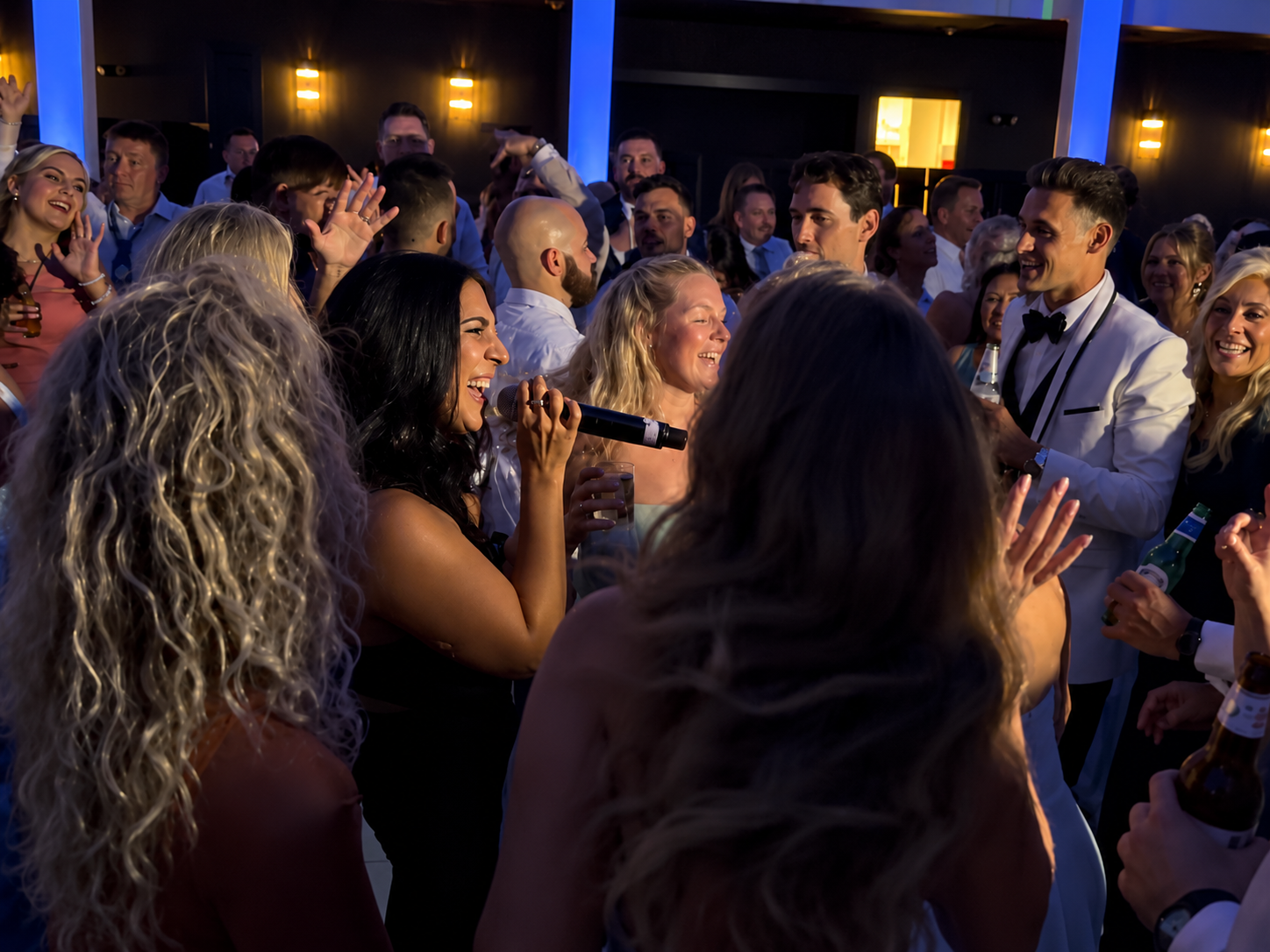Singer and Smiling Man on Dance Floor.png