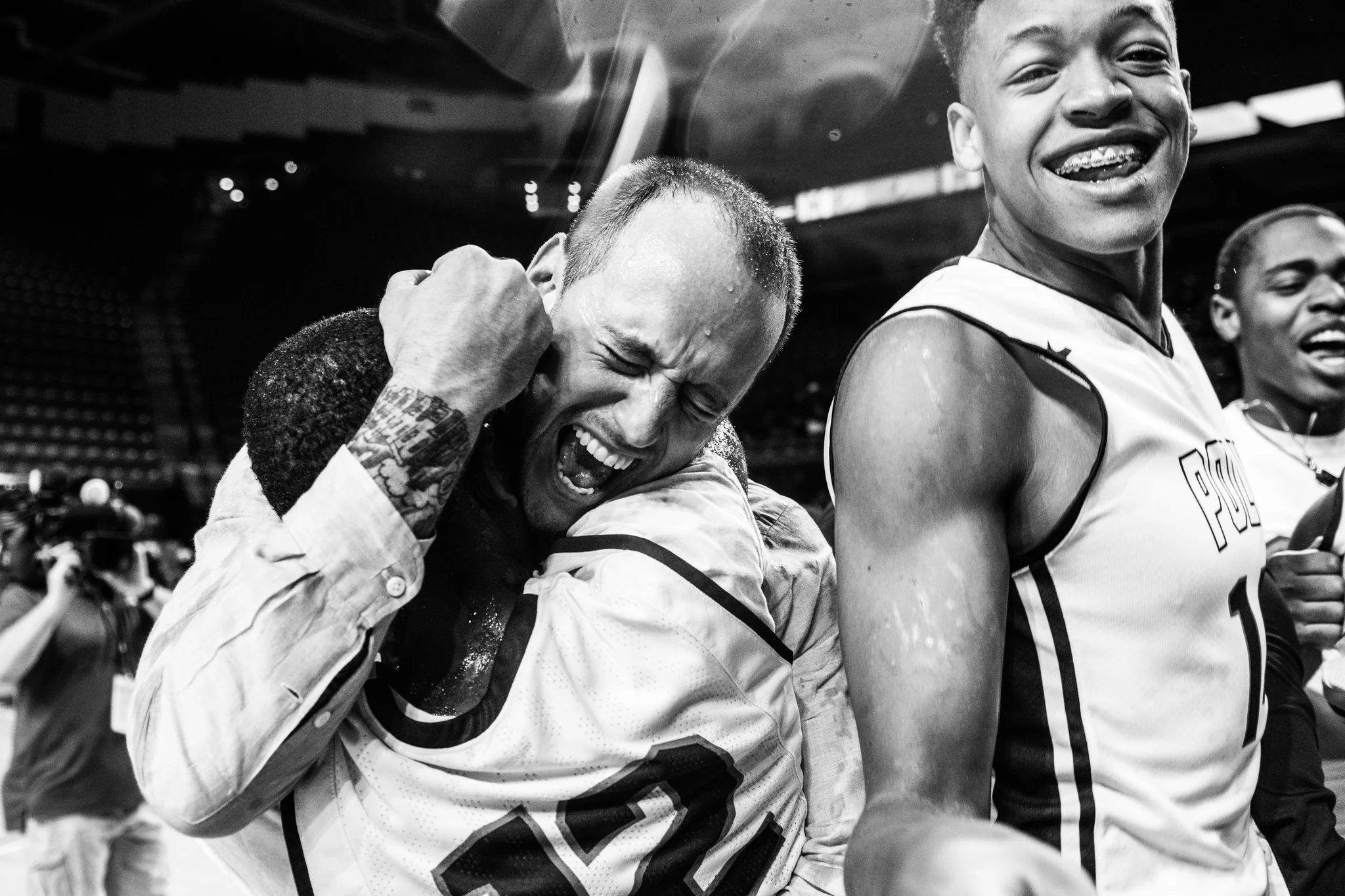 Coach Sam Brand celebrates his first state championship with a Baltimore Polytechnic Institute player. Photo Credit: City Paper, Reginald Thomas II