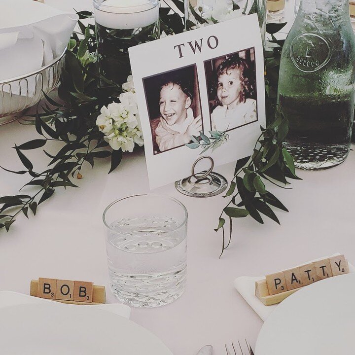 Best way to make your wedding about YOU? Table numbers of the bride and groom at that age were adorable and really fun! And Carly &amp; Josh translated their love of scrabble to assign seats. Place cards made by the happy couple for each guest to tak