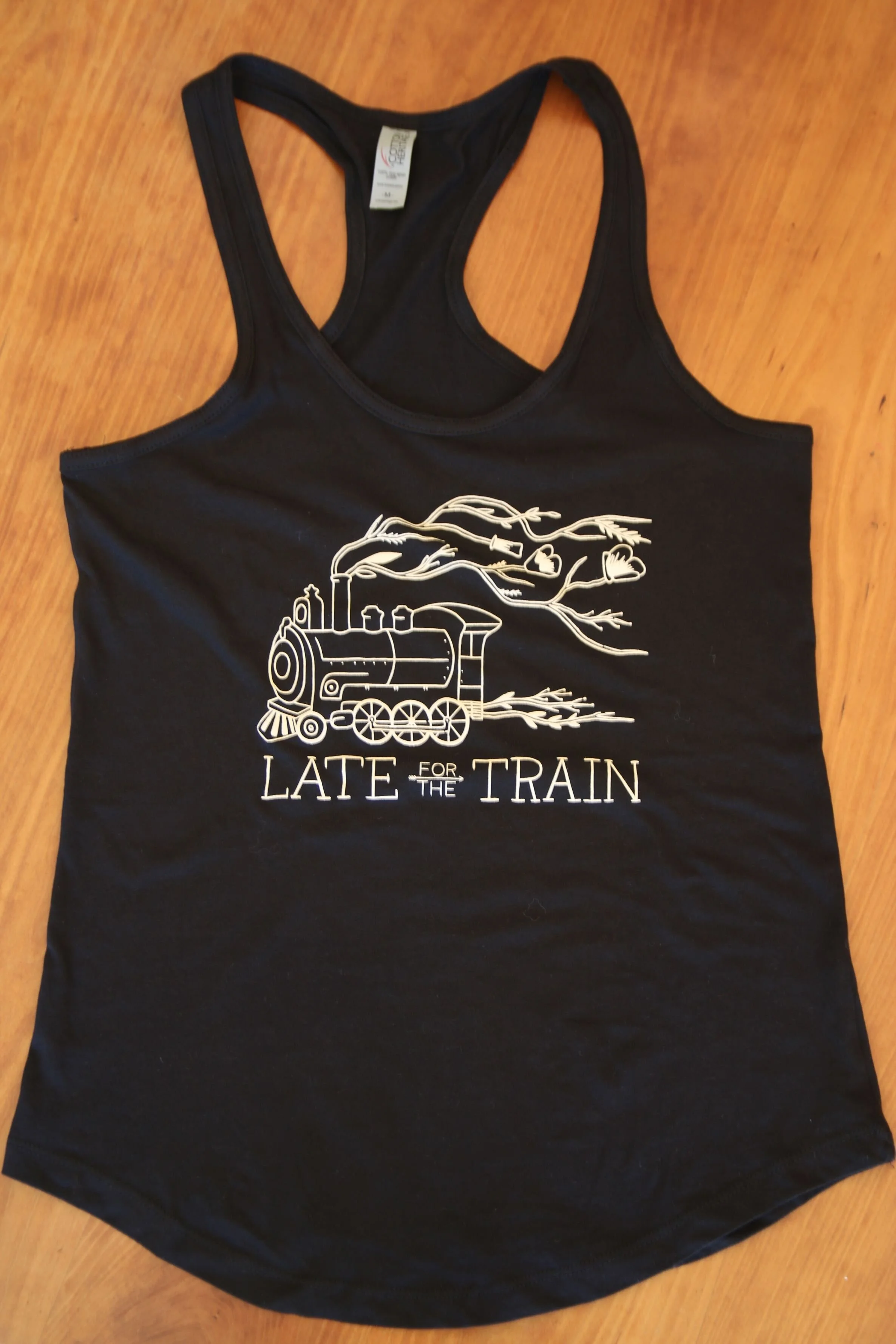 late-for-the-train-merch-black-womens-tank-logo.jpg