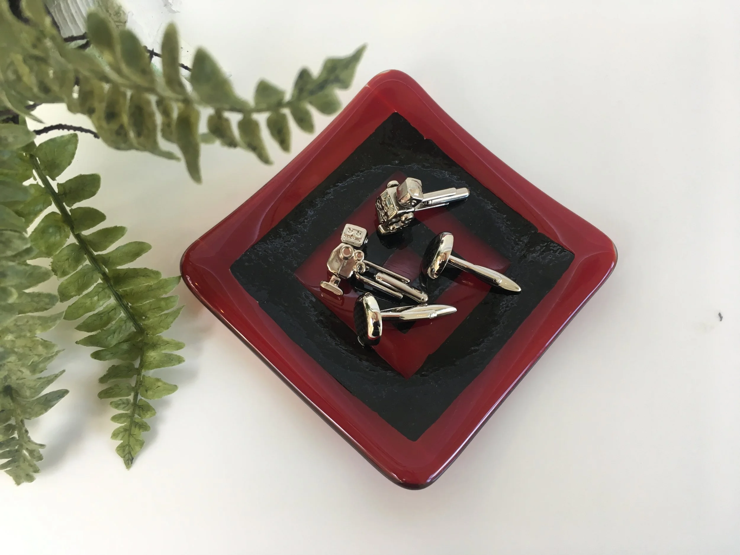 Red and iridescent black dish