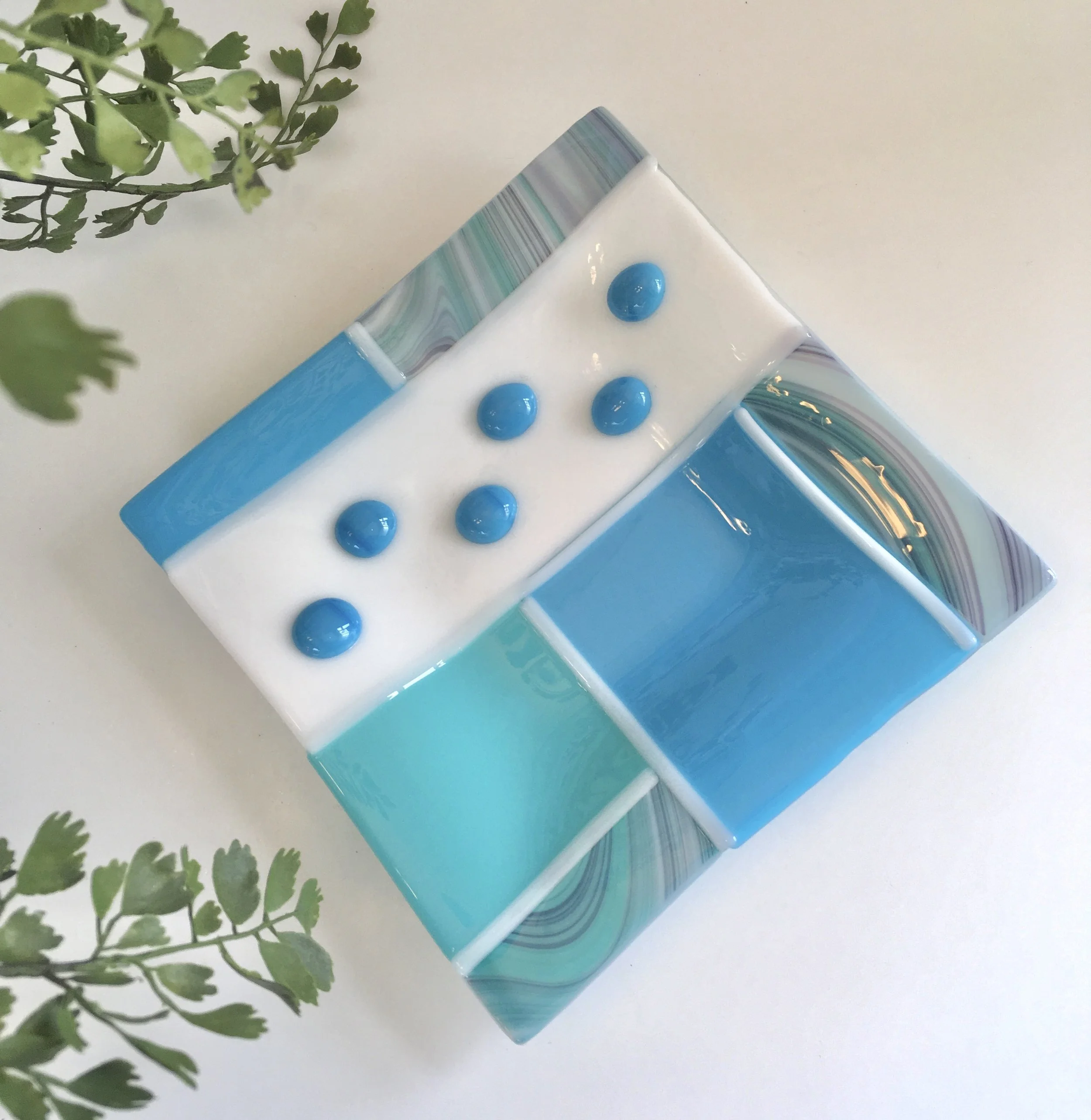 Graphics dish in shades of turquoise.