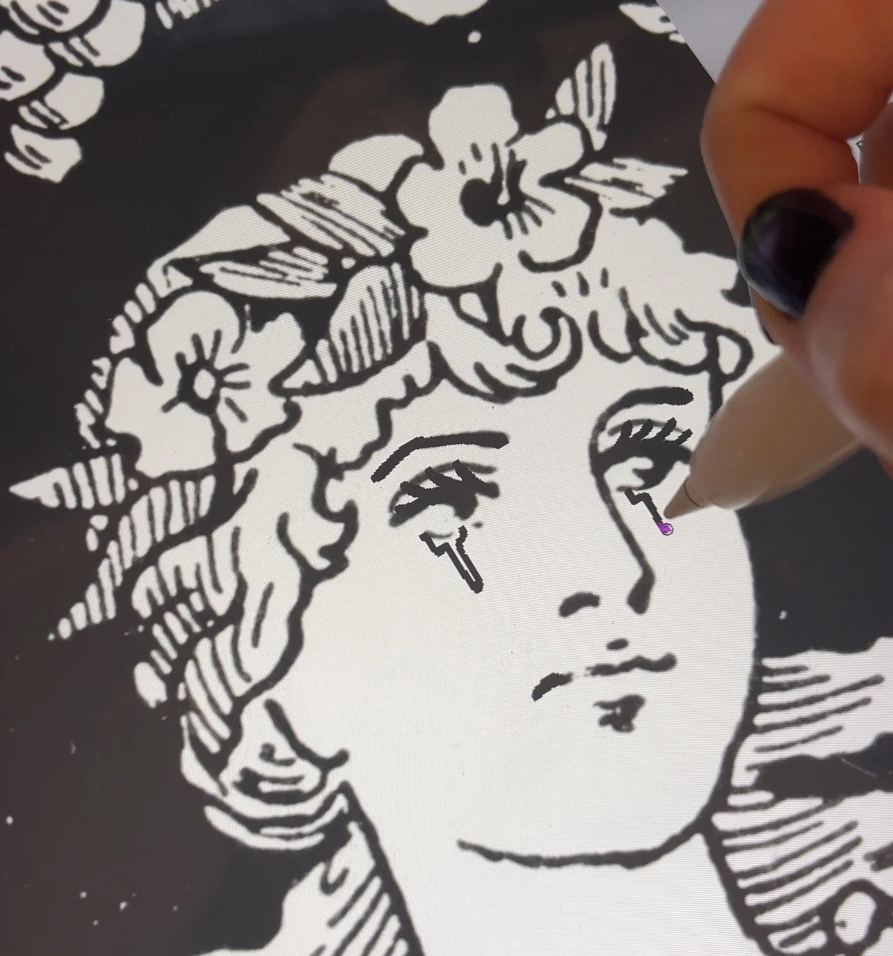 Zoomed in a close-up of medieval woman's face, showing a hand drawn tears