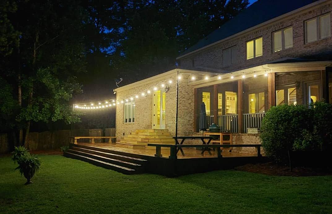 Transforming outdoor living spaces one string of lights at a time! #patiolighting #bistrolighting #cafelighting #edisonbulb #OutdoorLighting #eventlighting #glitterandglow