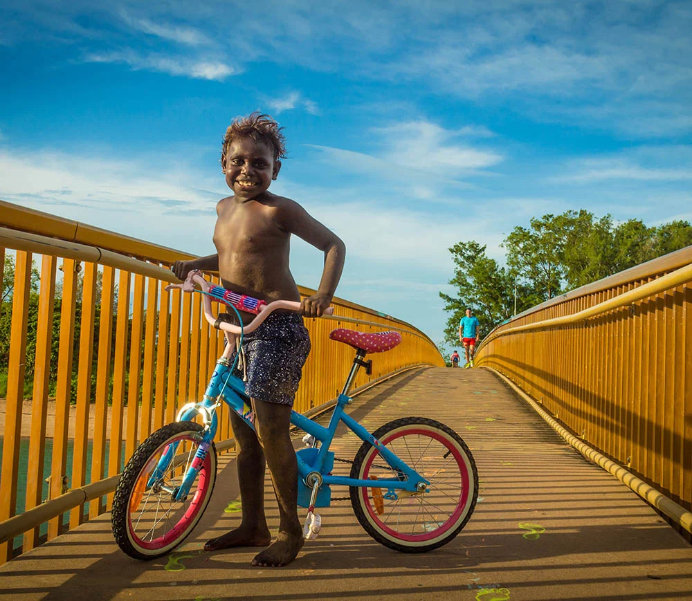 ChildOnBicycleRapidCreekBridgeDarwinAustralia.jpg