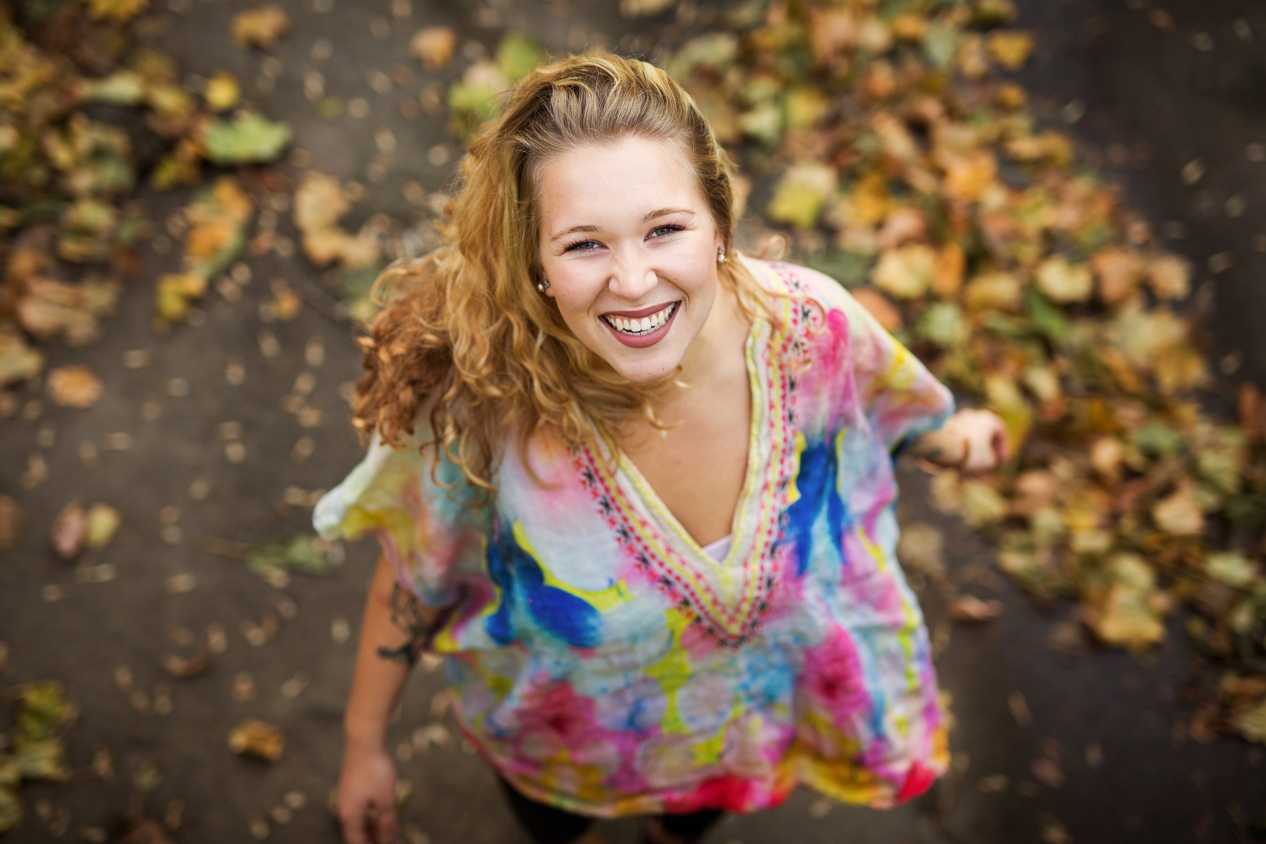 Mariah spinning in fall leaves