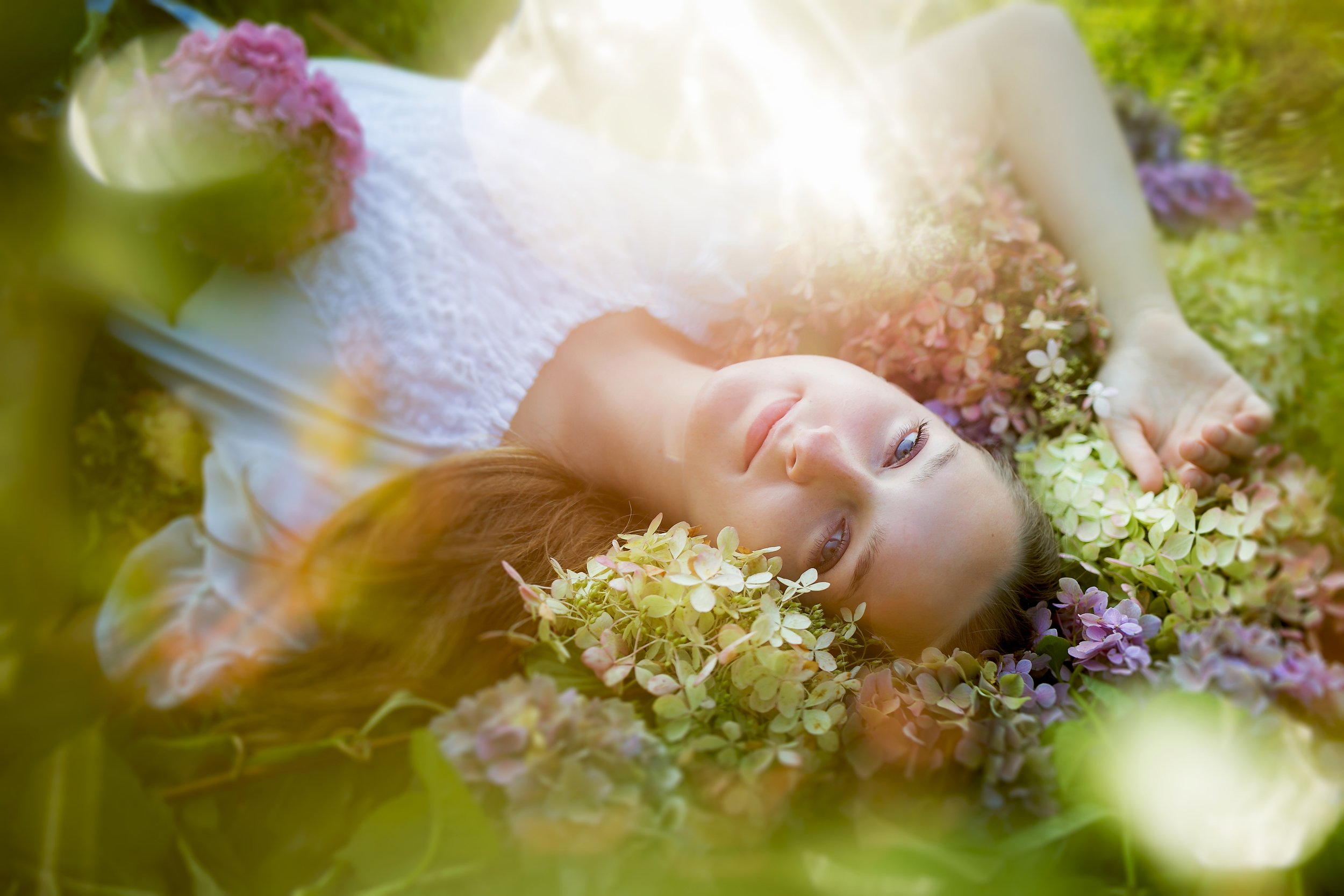 Senior lays in flowers