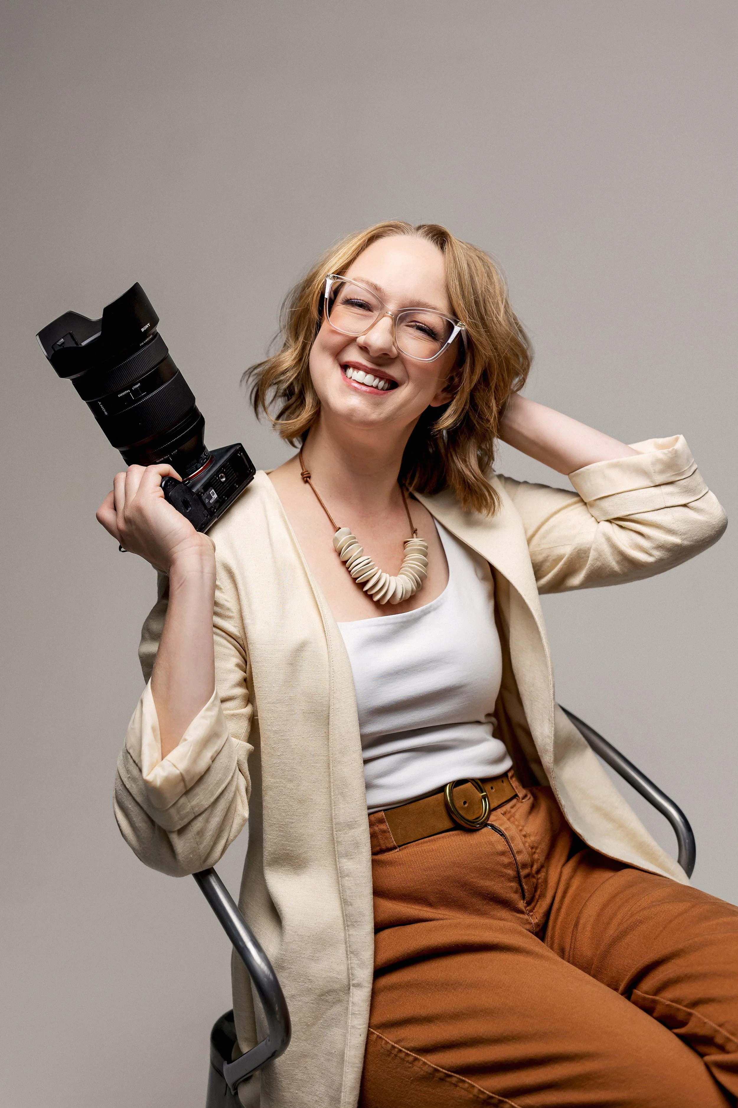 female pittsburgh photographer poses for her studio headshot