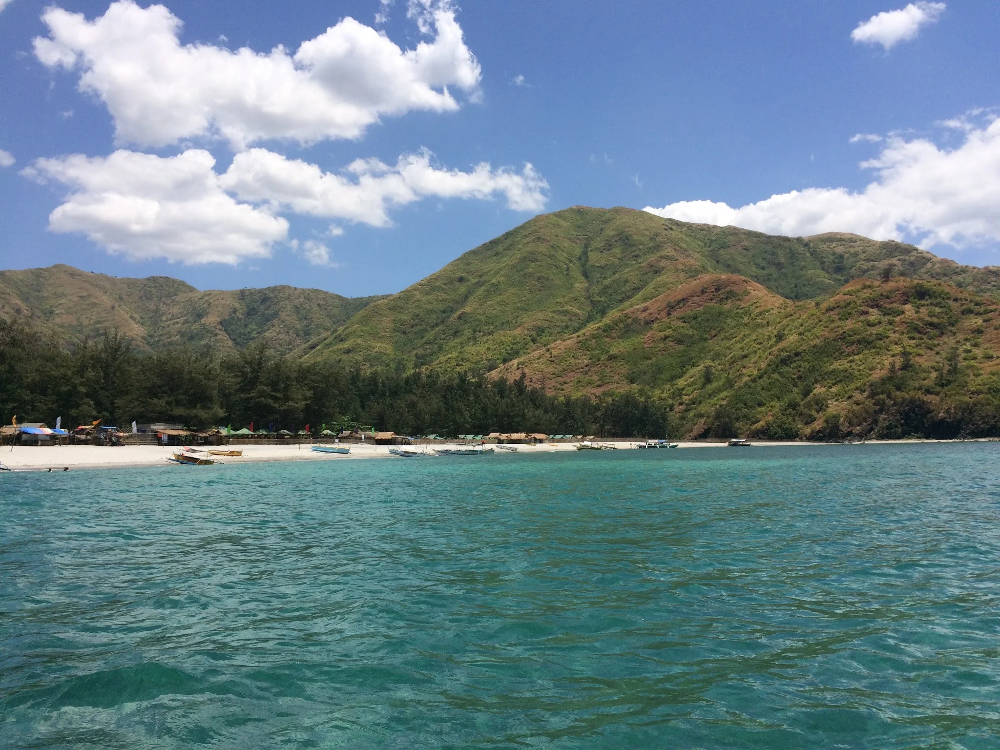 Pundaquit beach, San Antonio. View from the boat.