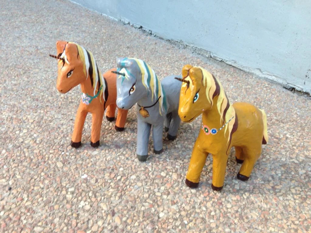 Unicorns made and handpainted by the artists above