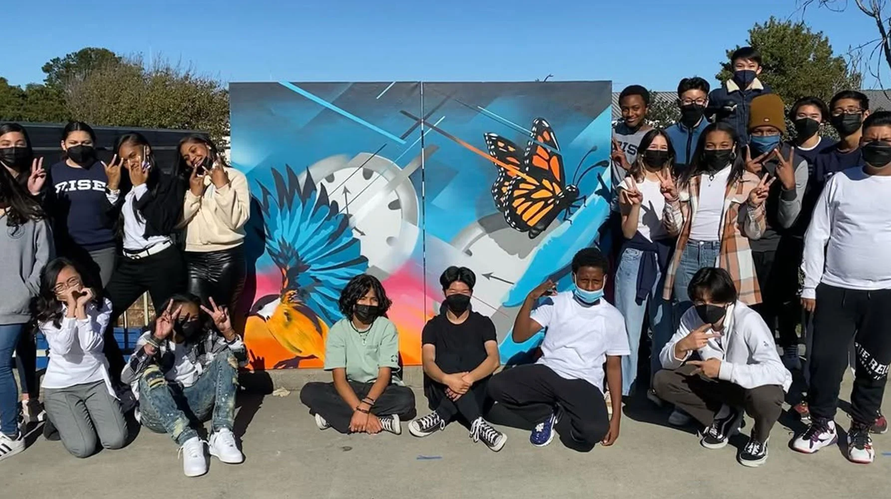 Education-Rise-University-Prep-Students-with-Colaboration-Mural.jpg