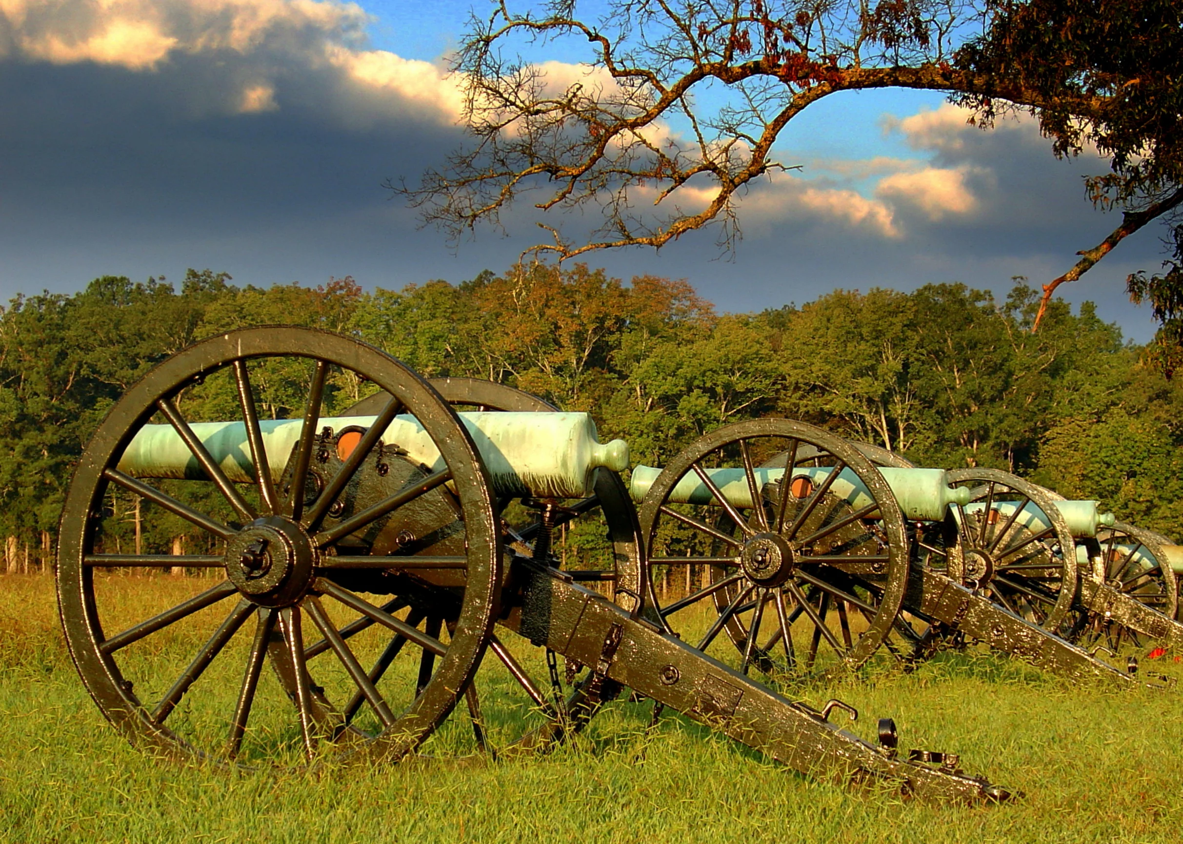 old military cannons on battlefield