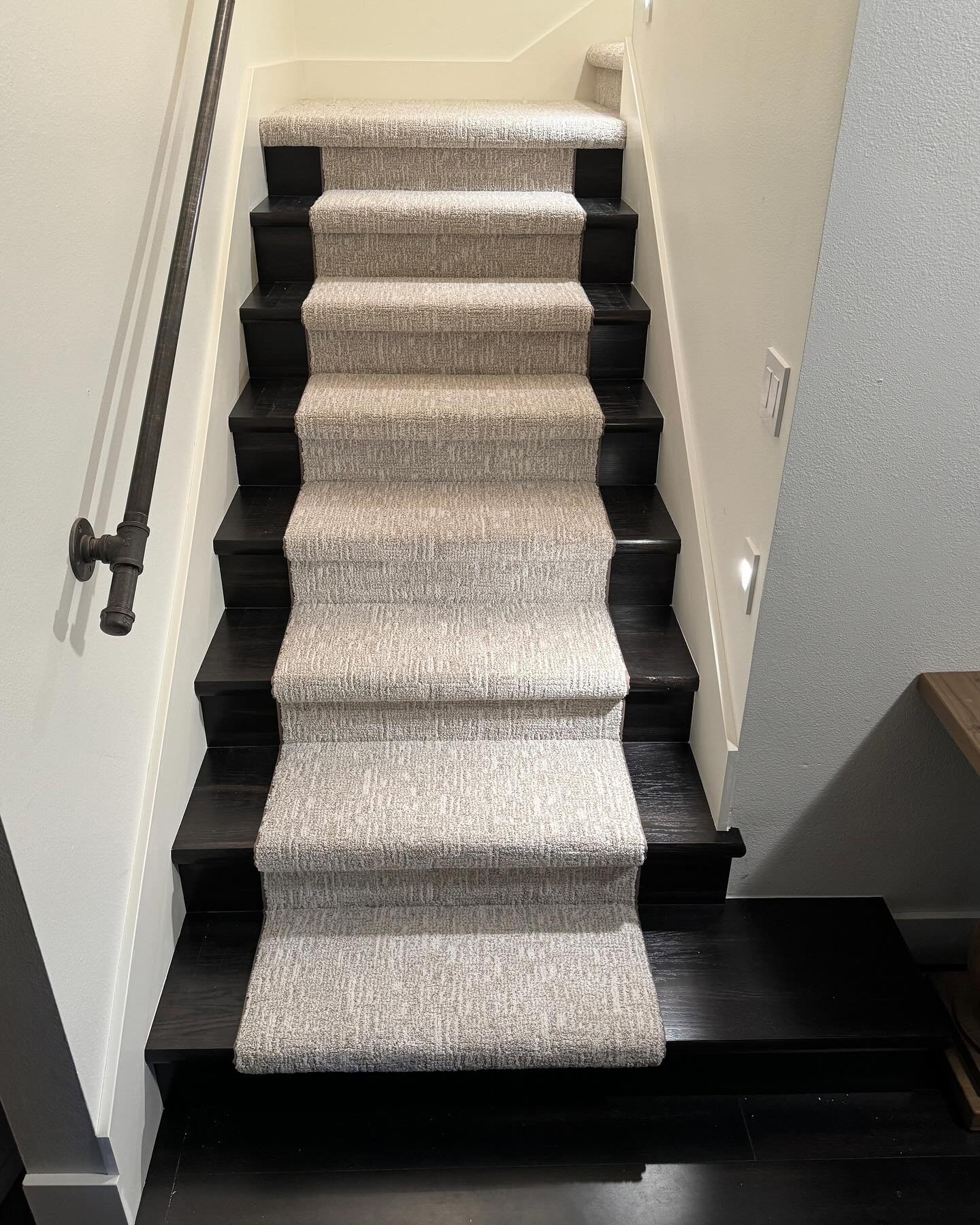 I covered the stairs in oak, then stained to match the flooring at the bottom of the stairs and then installed a carpet runner of the new carpeting that was installed upstairs. A lot of work but happy with the results. And more importantly the boss i