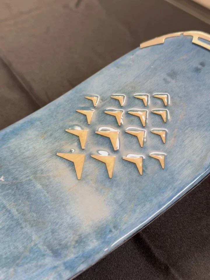 A custom shotski designed and built for Alaska Airlines&rsquo; &ldquo;World Tour&rdquo; holiday event.

From dyed maple veneer and laser-cut graphics to a durable epoxy finish and custom display blocks, this piece was built to be photographed, shared