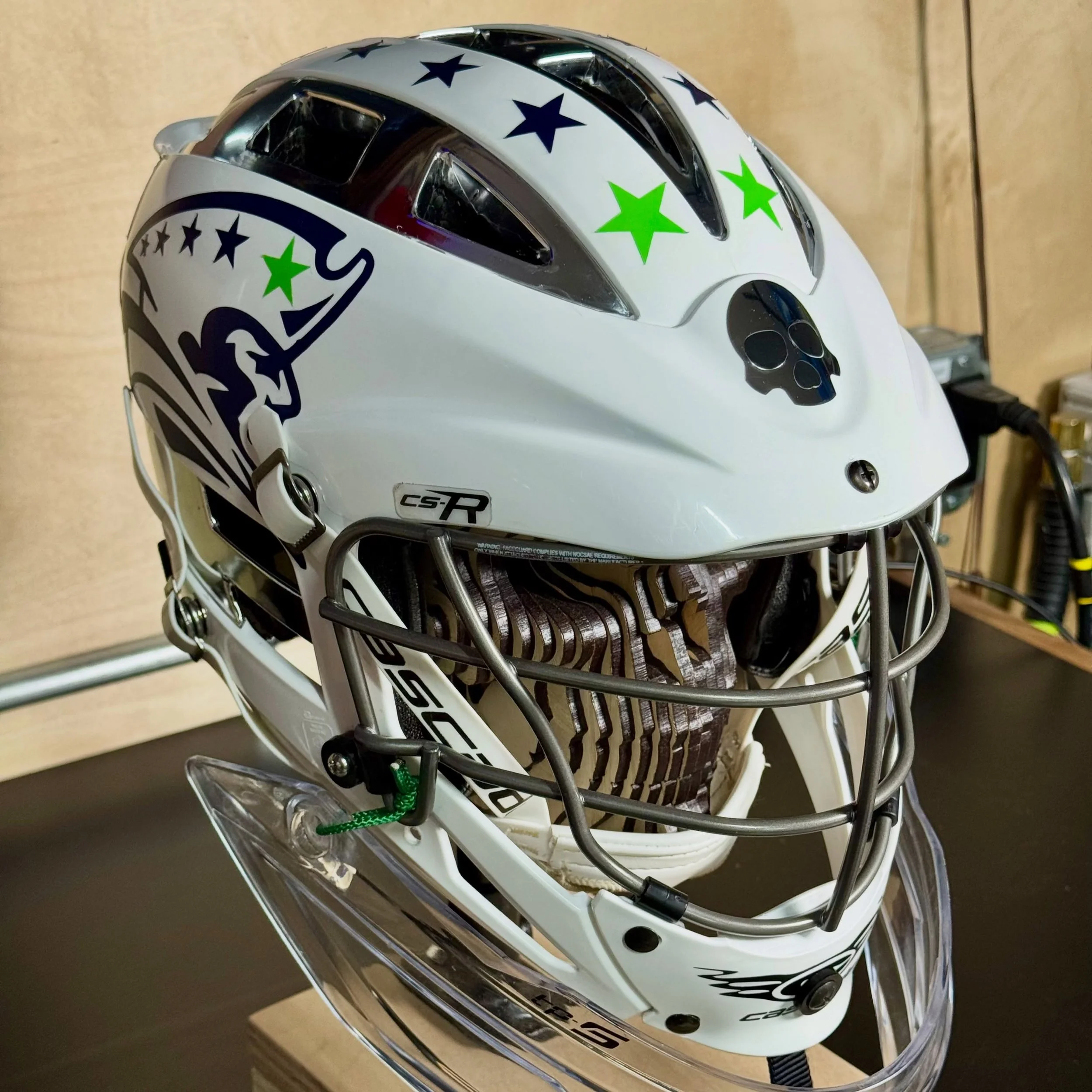 Spent a little time in the shop giving Jackson&rsquo;s @liberty_lacrosse_club goalie helmet some custom Patriots treatment.

I cut the vinyl decals and played around with a mix of team branding, player number, stars, and a little goalie attitude up f