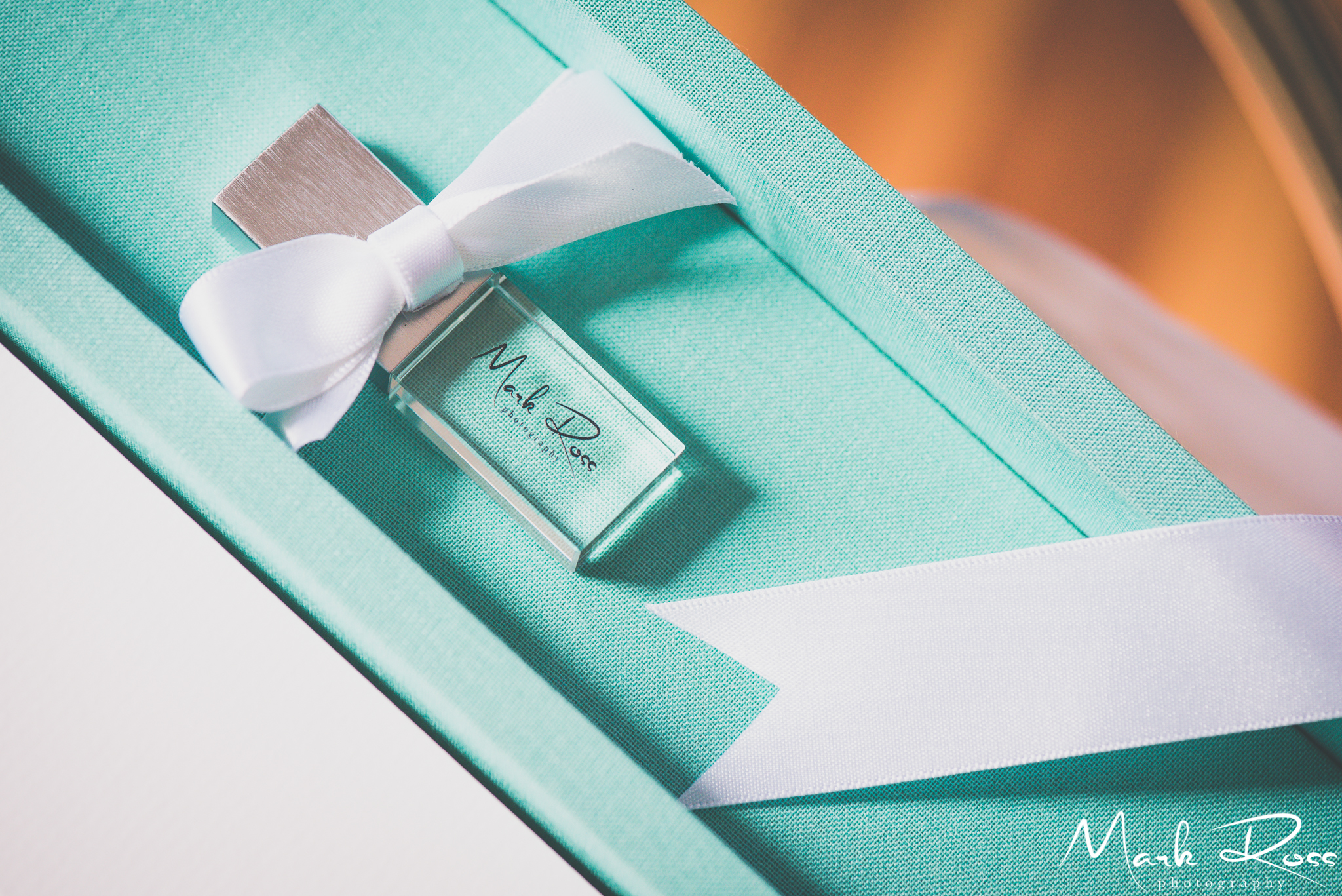 A sleek acrylic USB drive, containing a backup of Maggie’s images.