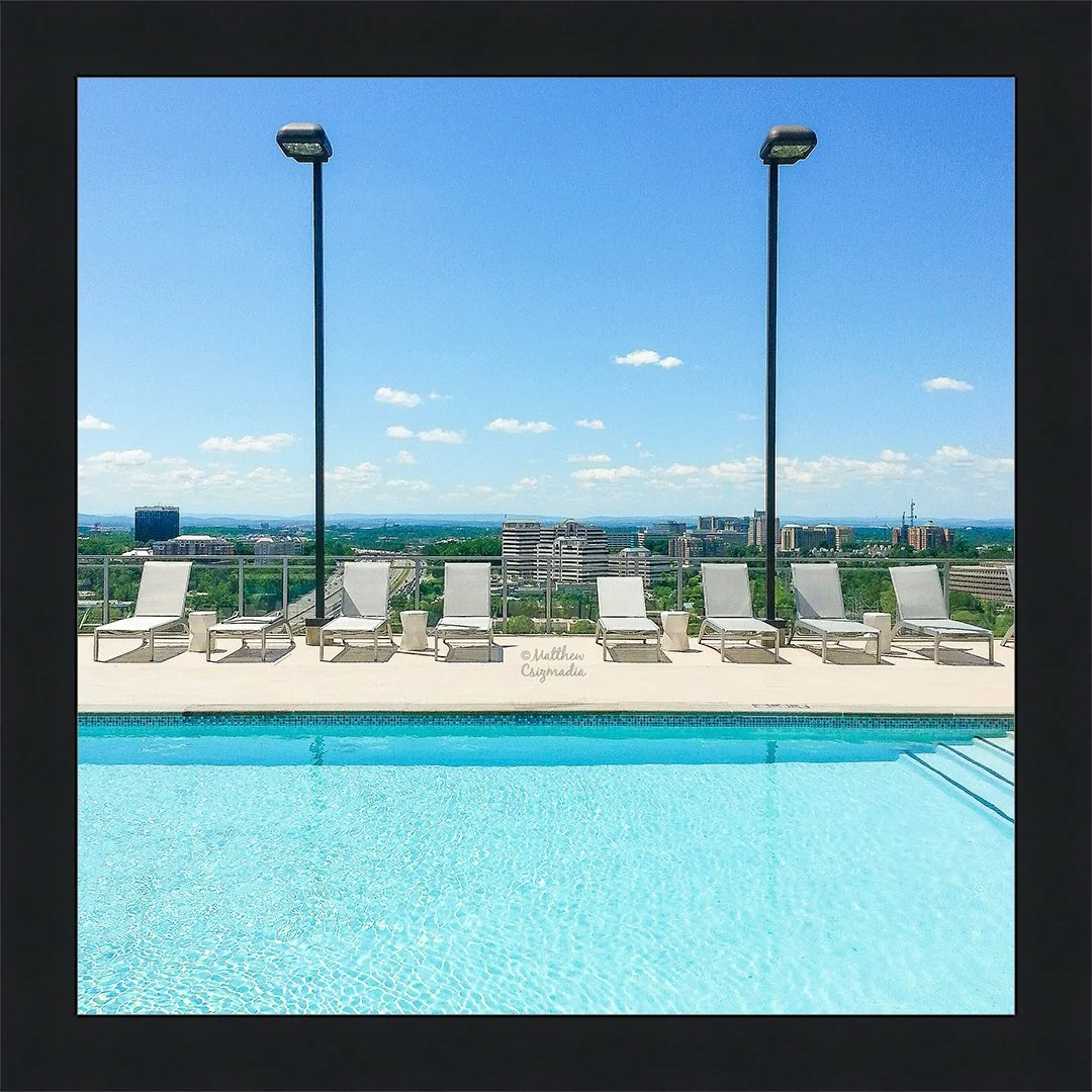 rooftop-pool-overlooking-city-skyline-swimming-matthew-csizmadia.jpg