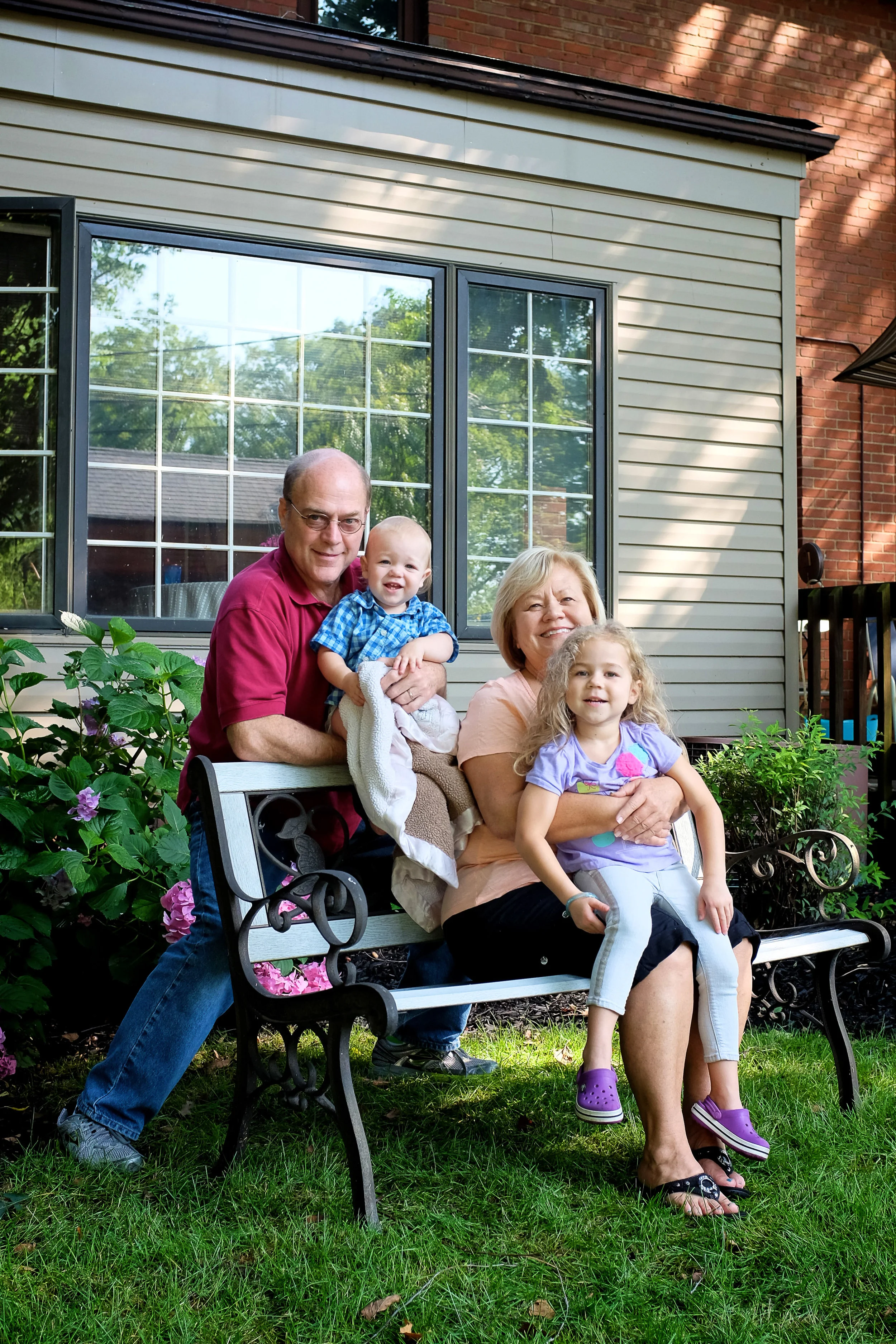 Dave & Nancy at their Euclid home with their grandchildren, Peter and Shelby.
