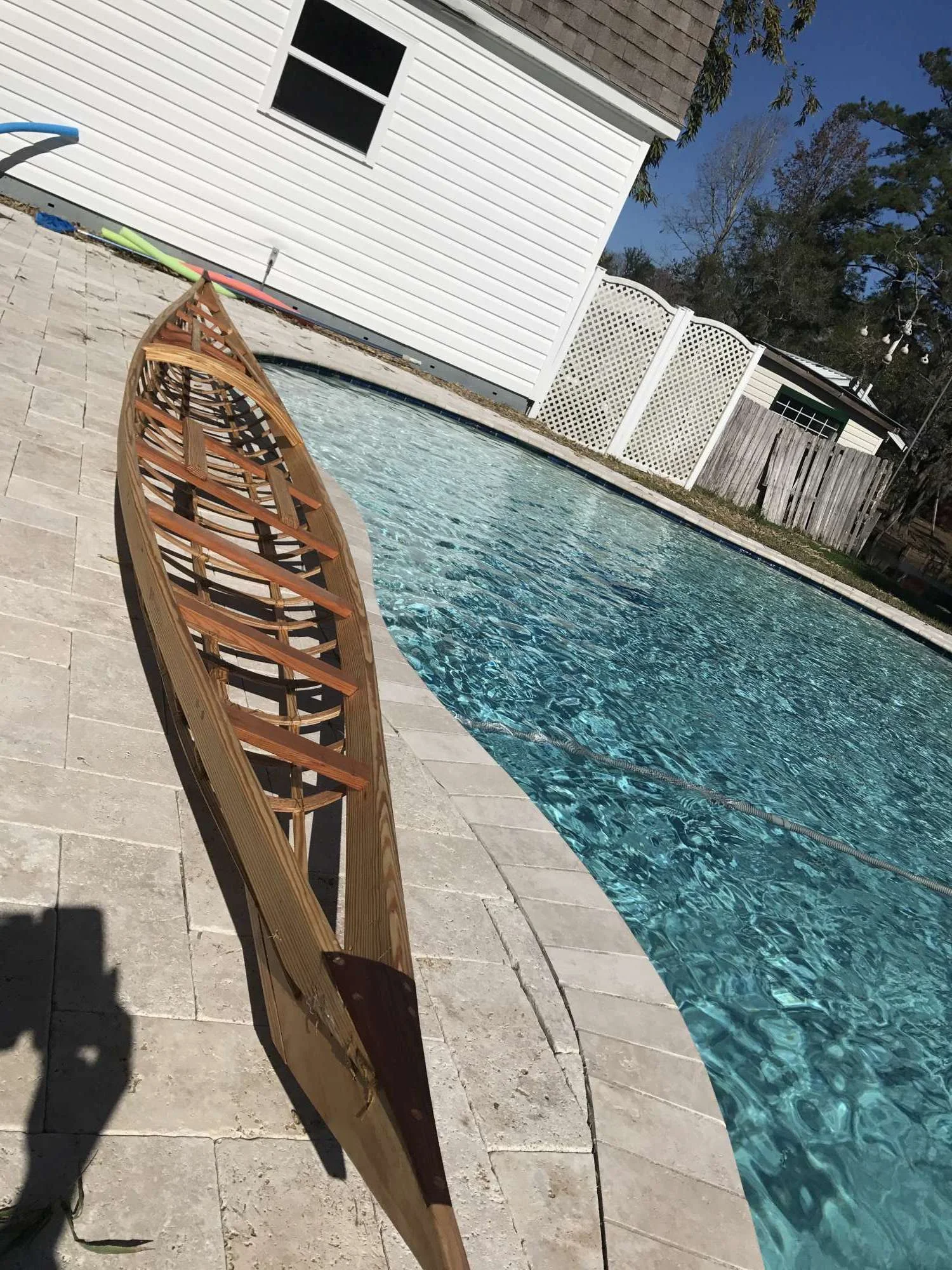 Not quite ready to be put in the water, but it is coated in tung oil (it absorbs into the wood) and the kayak is ready to be covered with fabric!