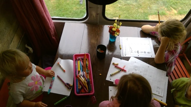 School for our family happens at the table, outside or even on the couch.