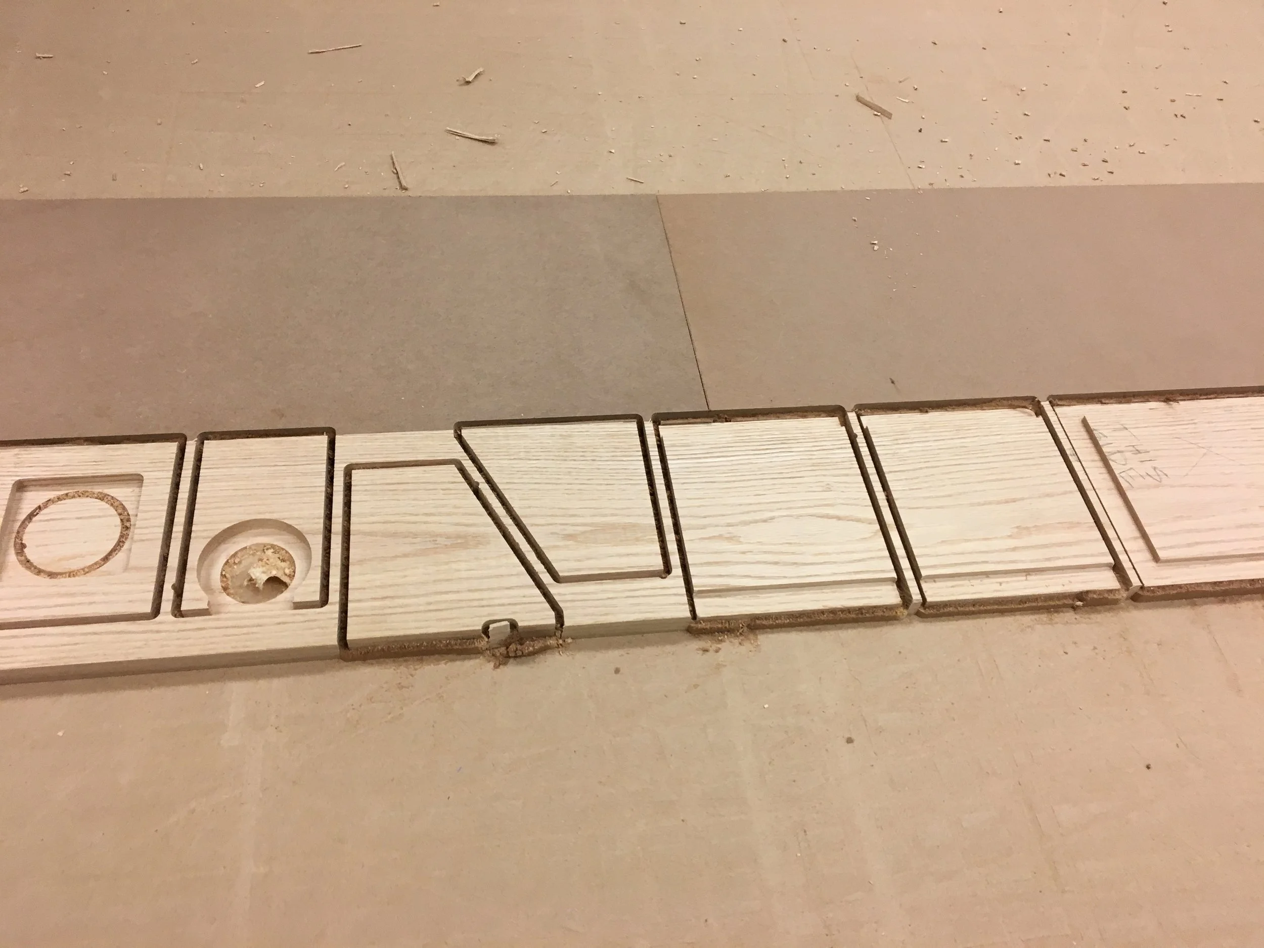  Parts and excess material still secured to the table 