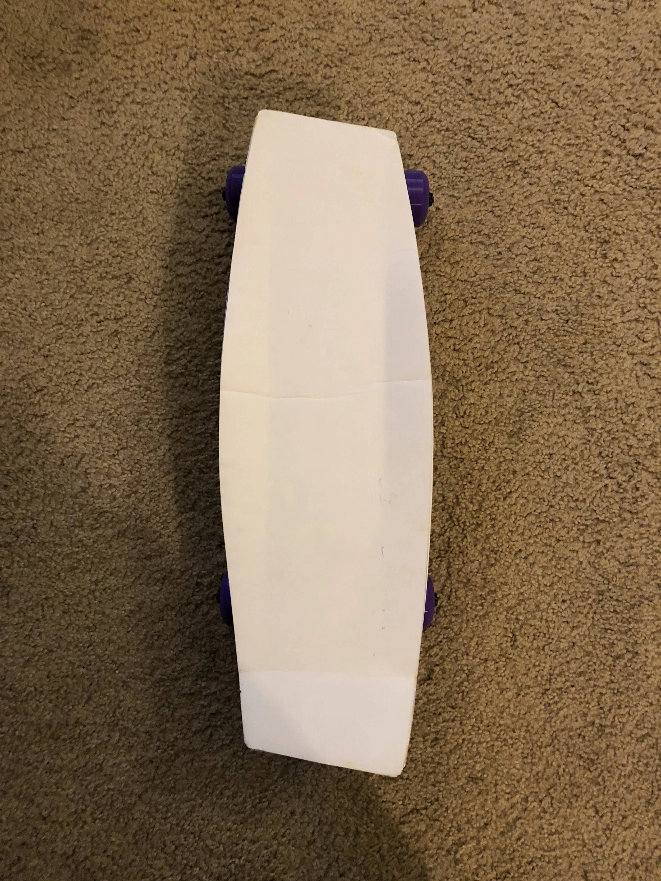 This helps to ensure that the board is the right size for my feet, doesn’t interfere with the wheels when turning hard, and will be an appropriate size to carry into class
