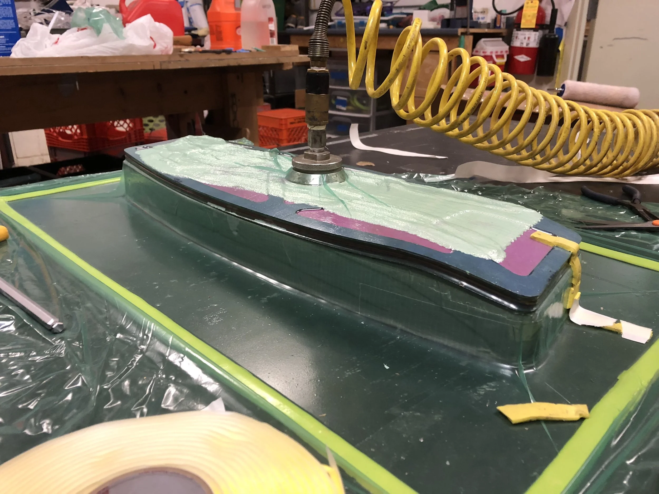 With the vacuum drawn we can see how easily and precisely the board takes the shape of the mold. This is one of the primary advantages to using the thin veneer plies