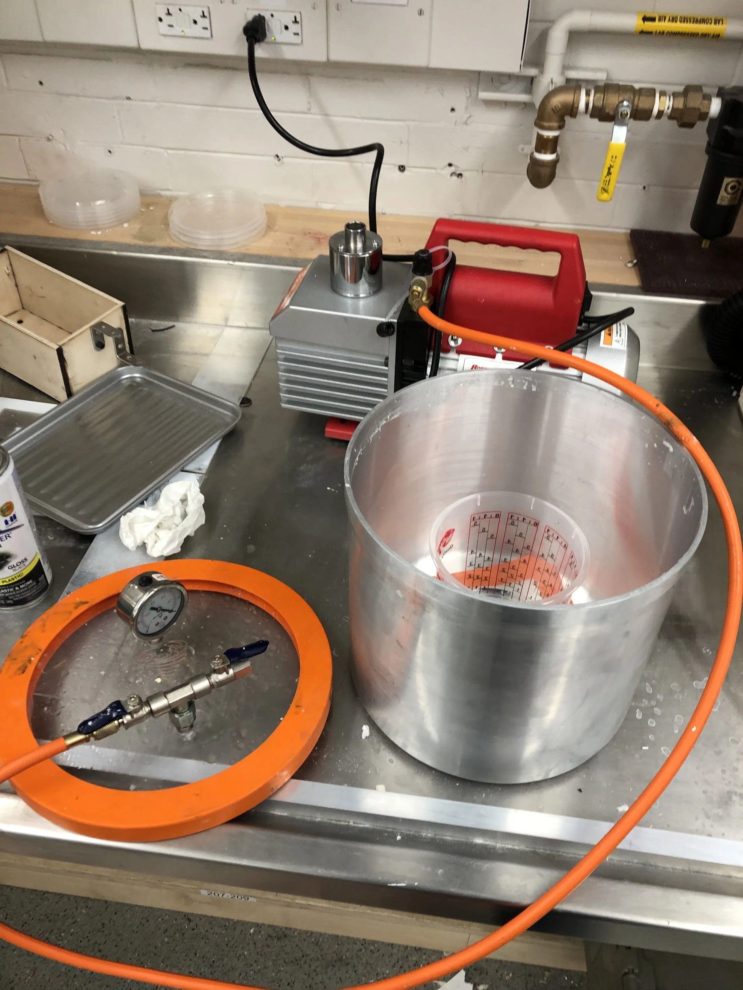 This requires using a vacuum pump to pull the air out while the parts are submerged in the oil