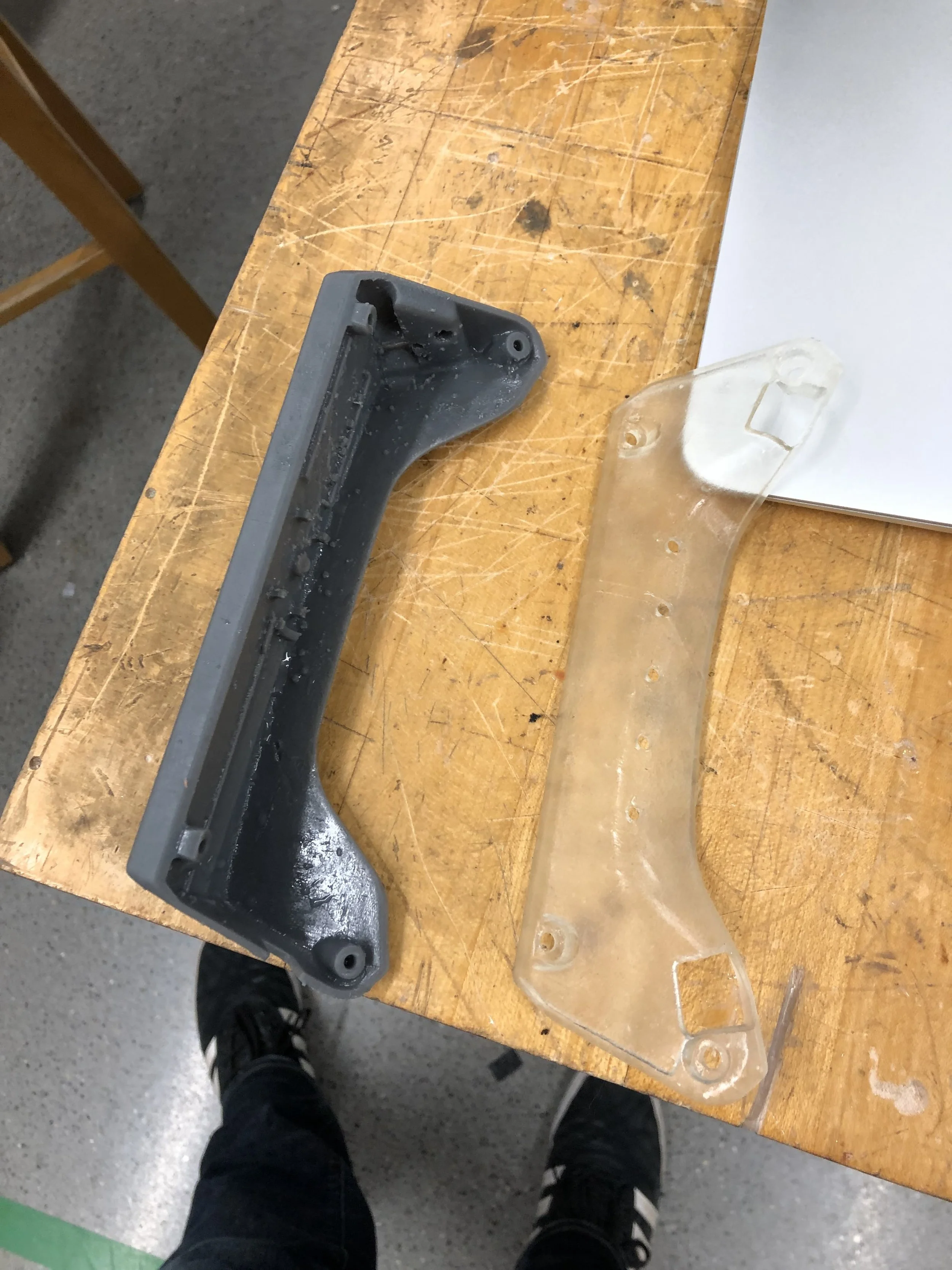 The enclosure halves fresh off the 3D printer. The front half (left) has all of the component mounting