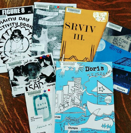 A pile of zines at the Olympia Timberland Library. (  @olympiazinelibrary  )