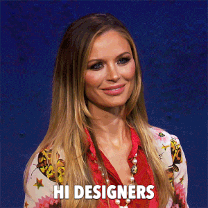 GIF of a Project Runway judge greeting the designers.